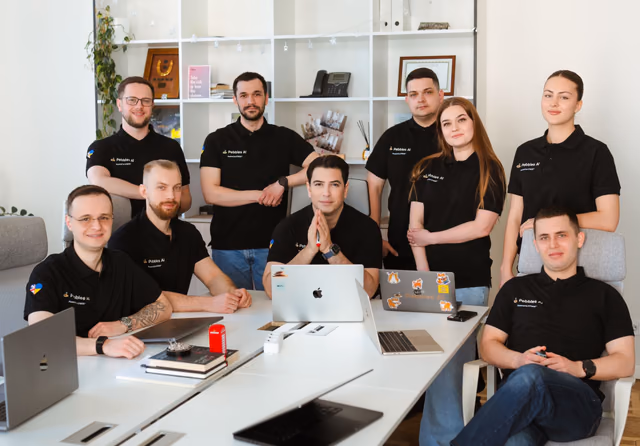 The Pebbles Ai team gathered around a table in the office