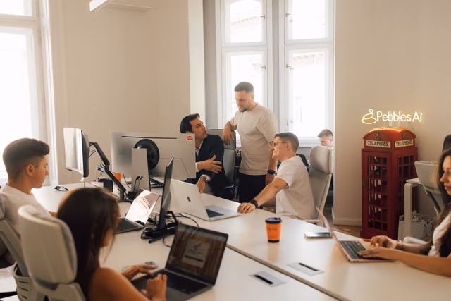 The team at work around shared desks in the office