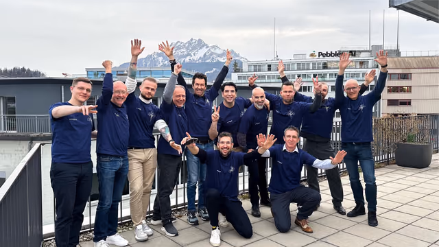 The Pebbles Ai team celebrating on a rooftop